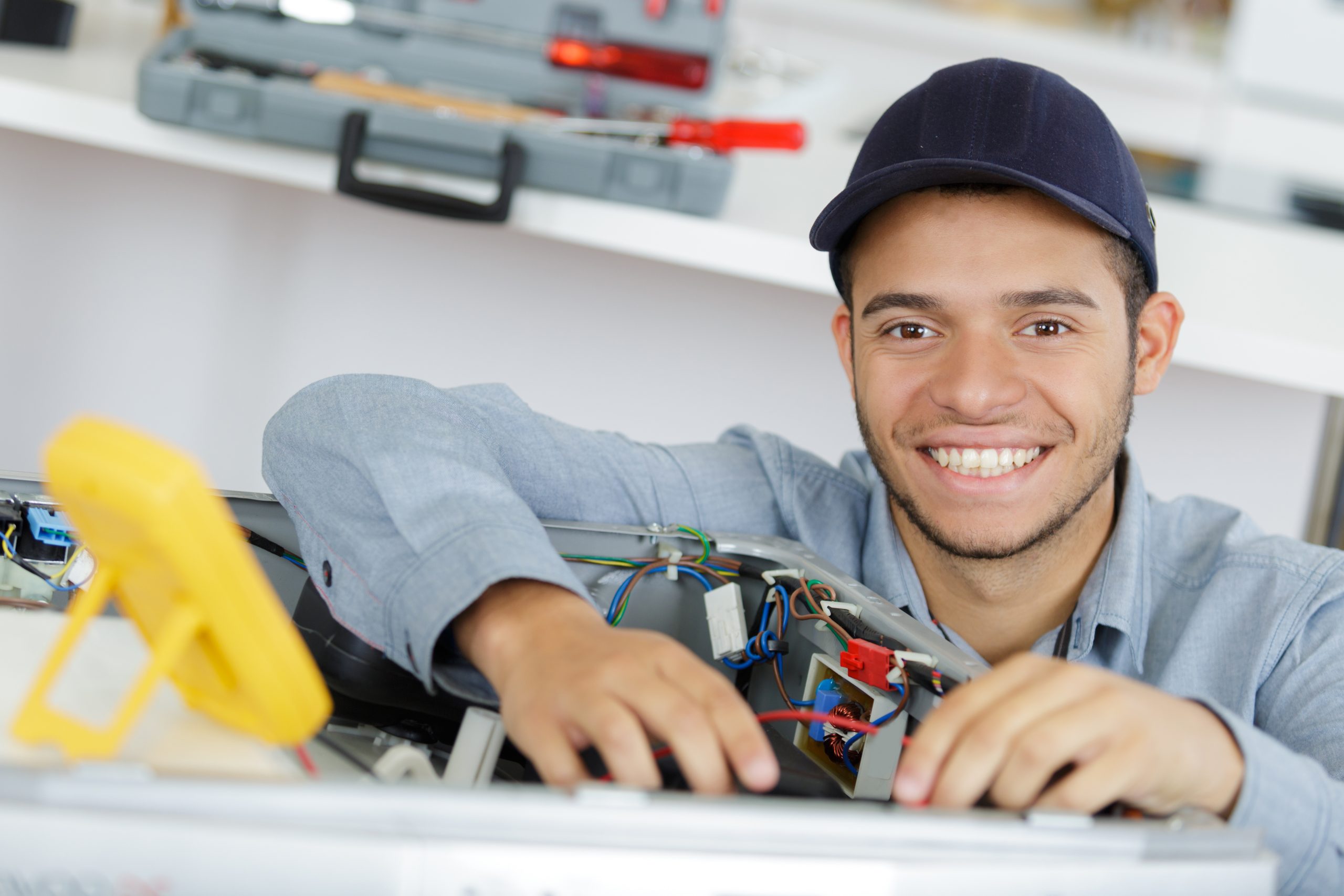 a smiling young male worker